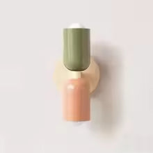 Applique murale chambre deux cotes blanc rose et vert sur un mur